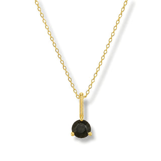 Colar Sign ponto de luz Ônix banhado a ouro 18K da UNA em fundo branco, com pedra preta sofisticada