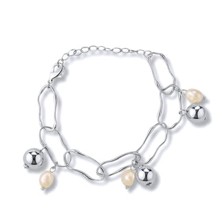 Pulseira com pérola barroca e bola banhada a ródio da UNA, semijoia sofisticada em fundo neutro com design elegante
